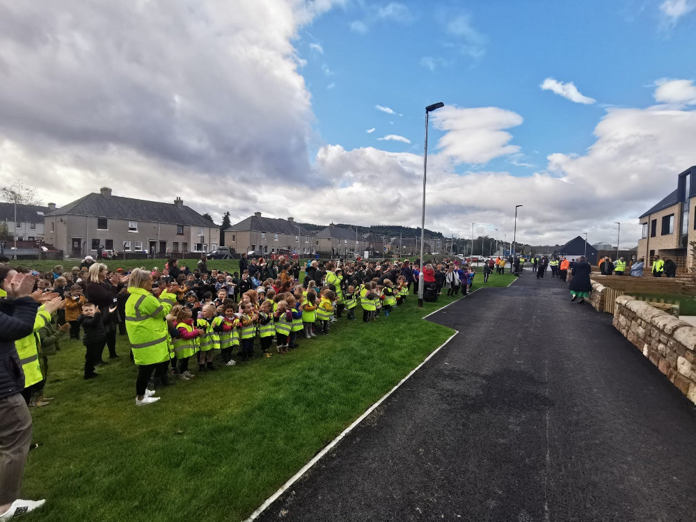 Robertson Construction workers applauded by pupils on completion of school
