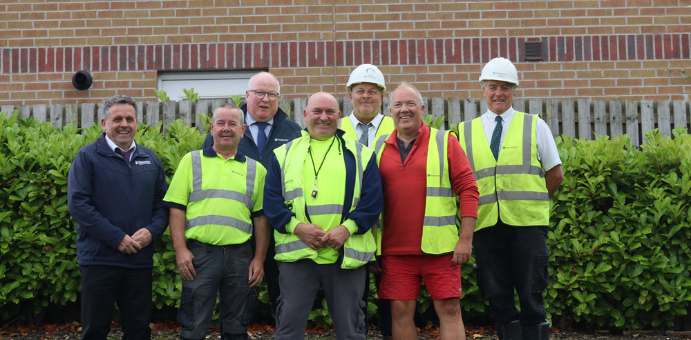 Long service recognition for band of Persimmon builders